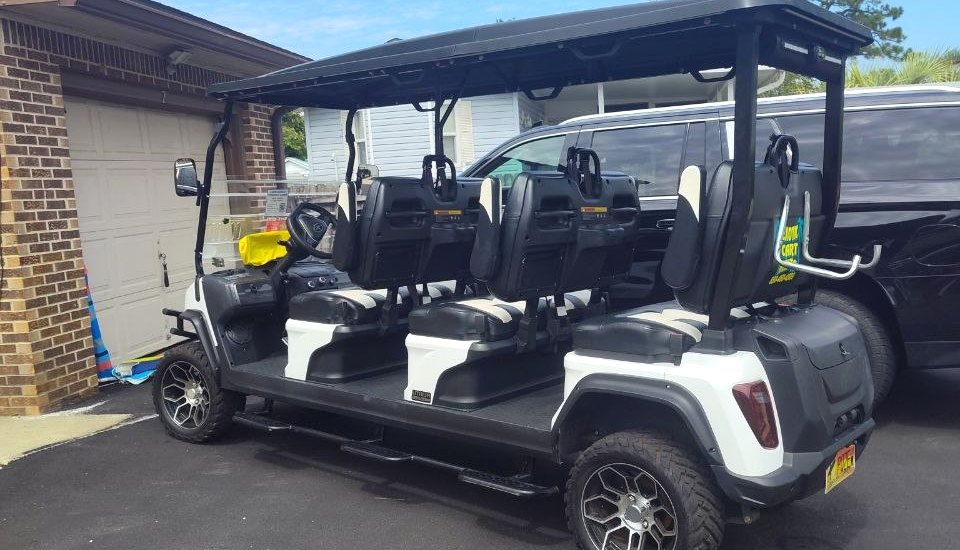 Family of six in golf cart Miramar Beach